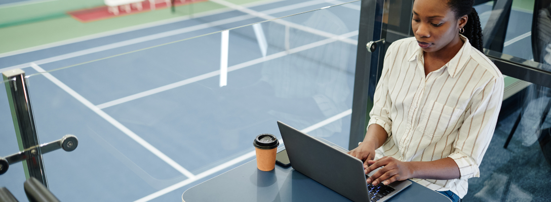 Woman Taking Notes on Sports Insights for Betting Strategy